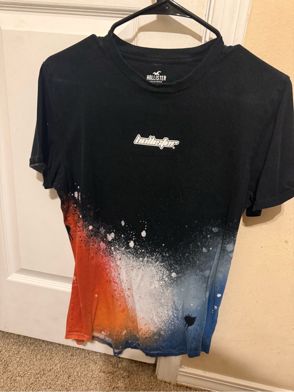 Hollister Black Crewneck T-Shirt with Red White and Blue Spray Graphic